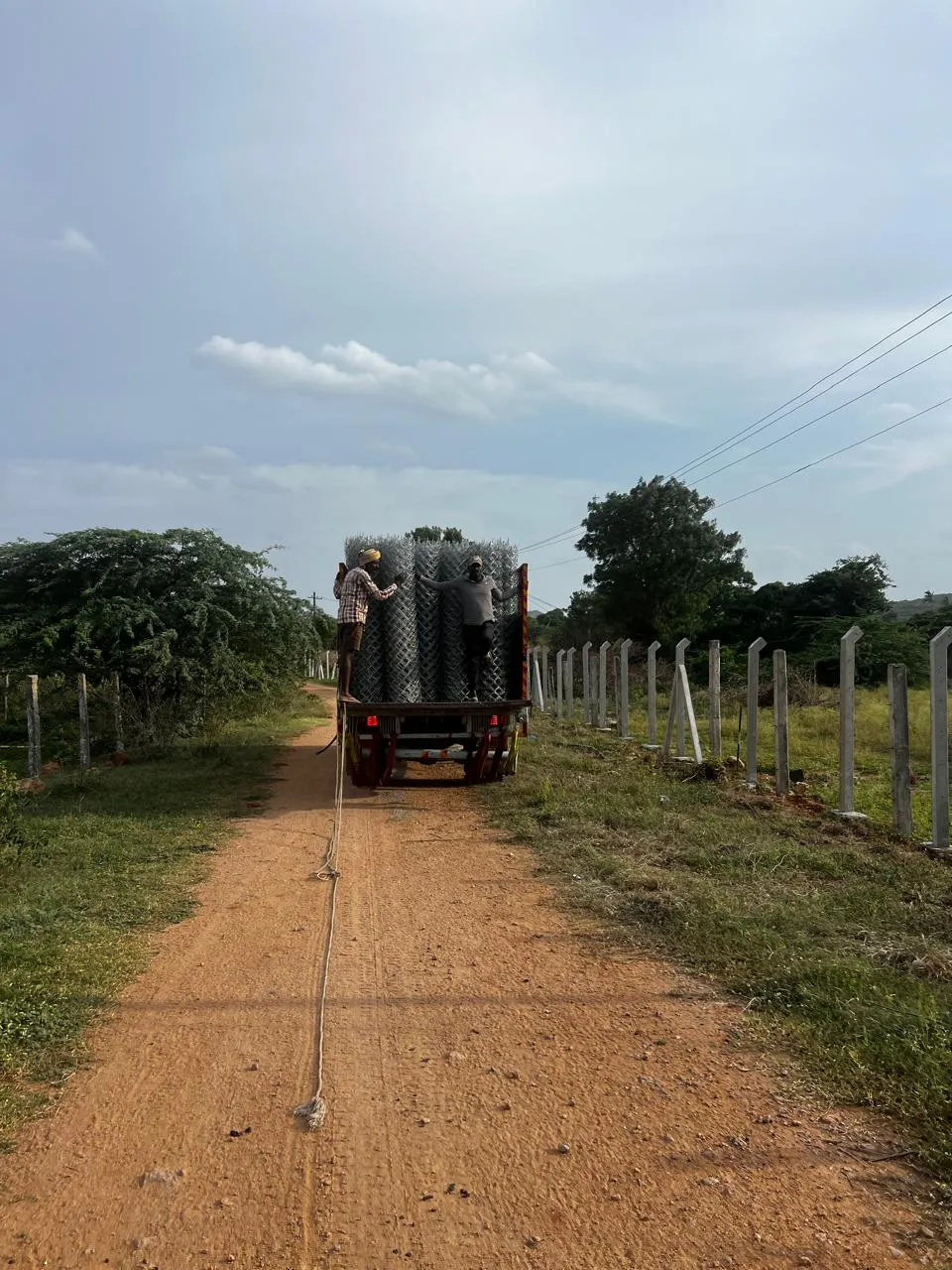 Delivering chain link rolls to site